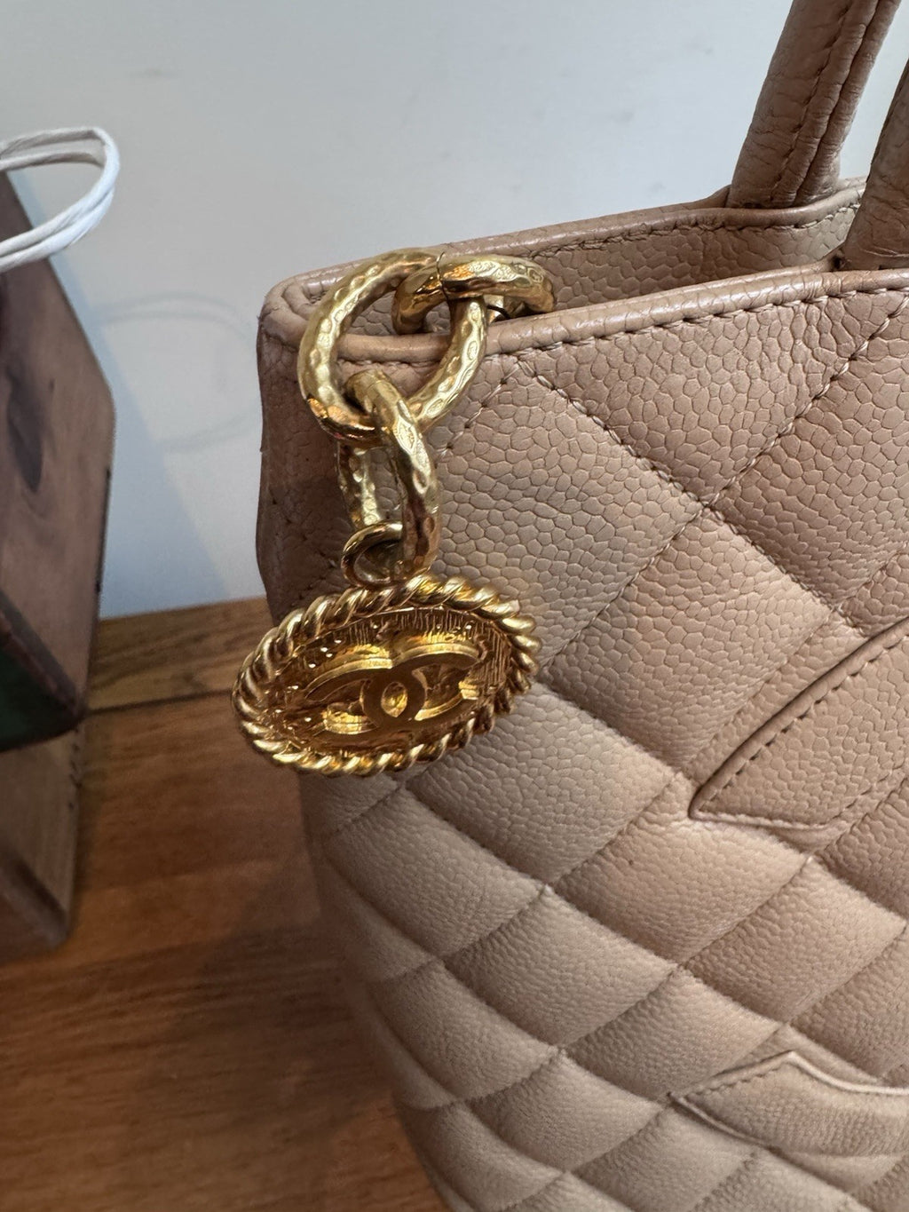 CHANEL Beige Medallion Tote,zip Closure quilted caviar leather